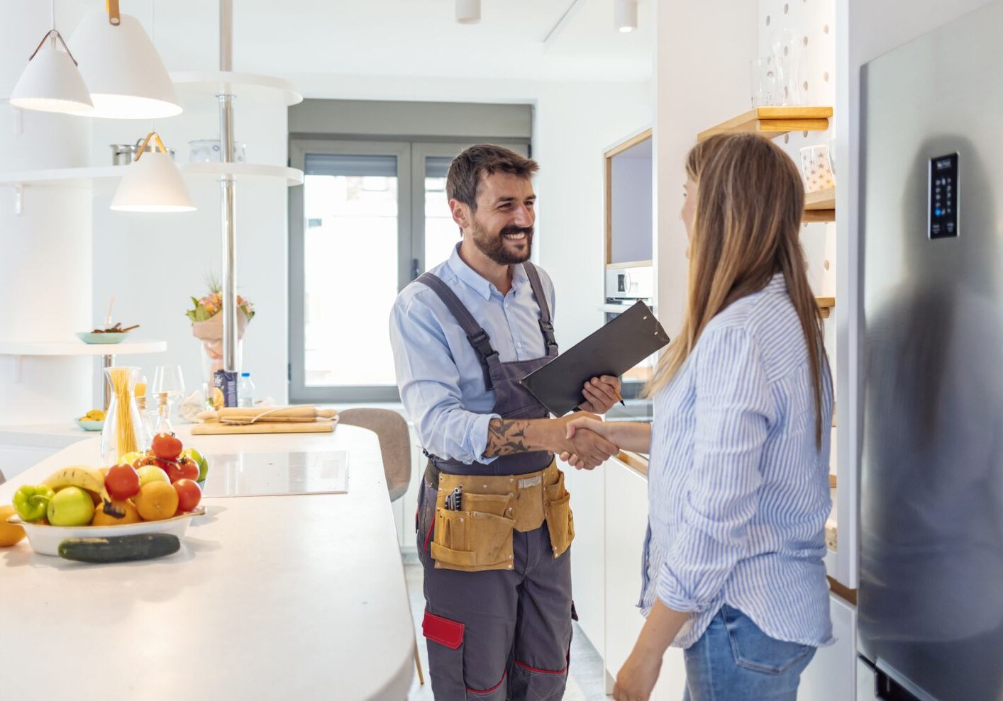 friendly plumber contractor speaking with client