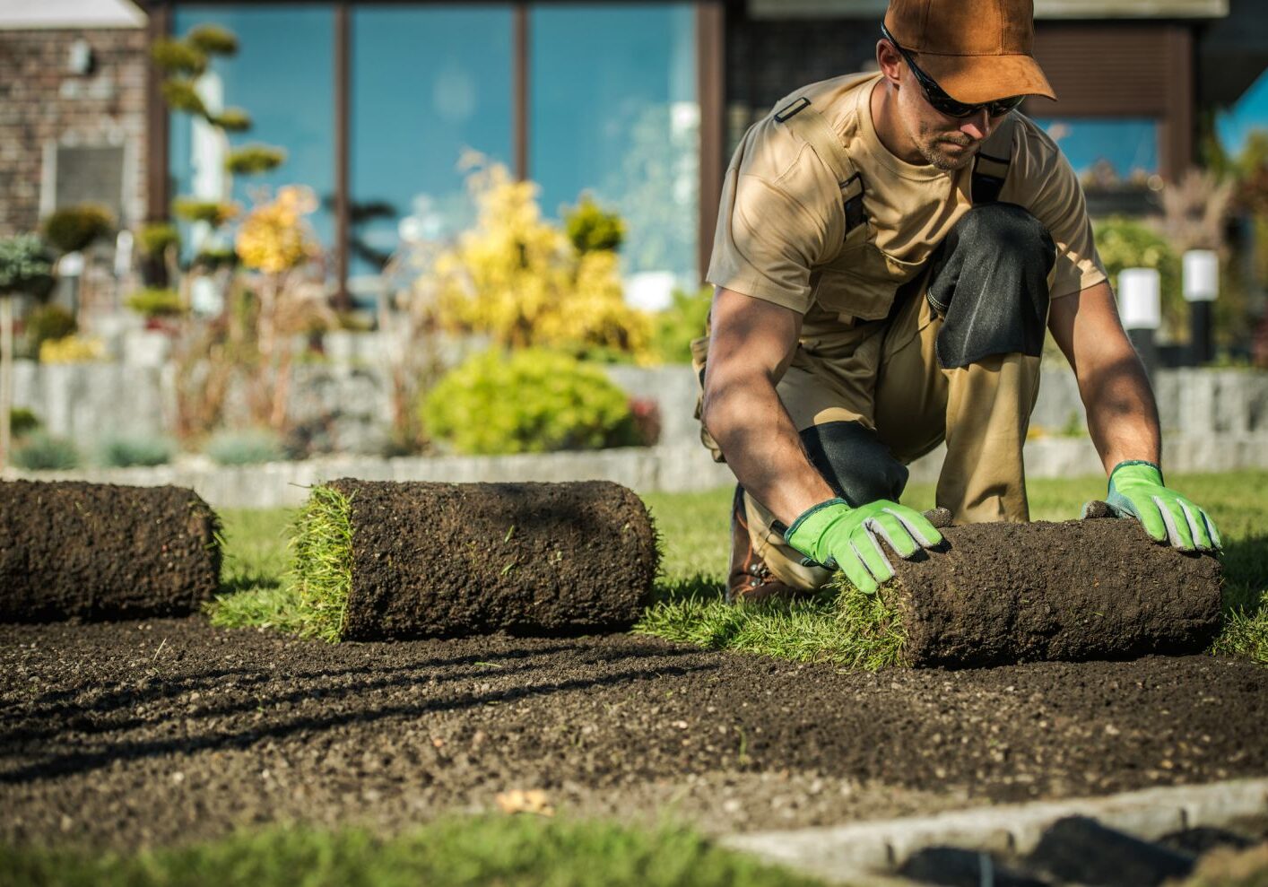 landscaping contractor laying sod